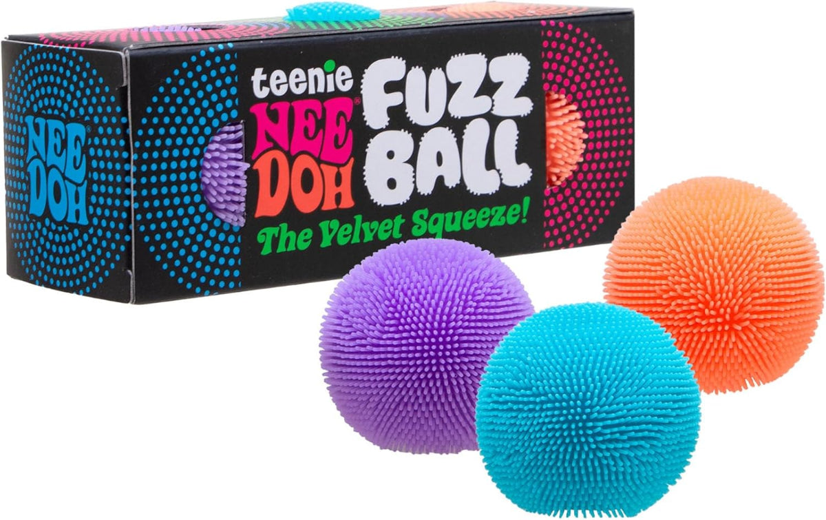 Colorful fuzz balls with packaging labeled 'teenie Nee Doh Fuzz Ball' on a white background.